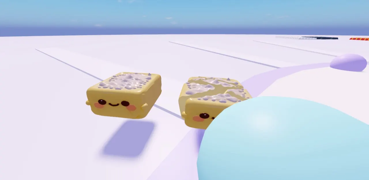 Two smiling butter squishies on a pastel tower path